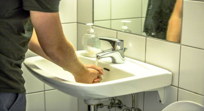 washing hands in public toilets