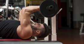 Build bigger arms with lying triceps extension