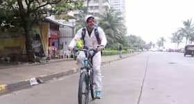 Bang Bang Dare: Farhan Akhtar cycles in a skydiving suit on Mumbai roads for Hrithik Roshan Bang Bang Dare: Farhan Akhtar cycles in a skydiving suit on Mumbai roads for Hrithik Roshan
