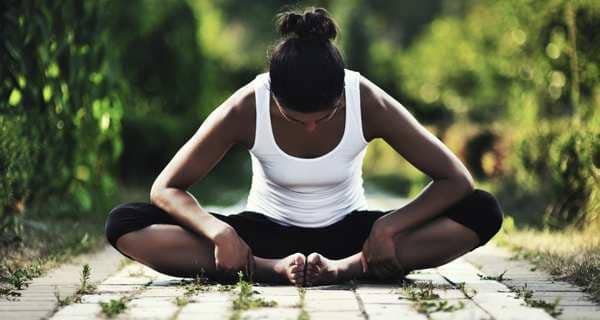 woman doing yoga exercise, sitting in baddha konasana, butterfly pose. Full  length shot Stock Photo | Adobe Stock