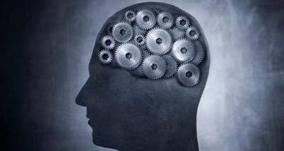 Man Holding A Lit Lantern On A Dark Path On