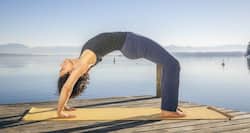 Lose weight from your back and hips with urdhva dhanurasana or the upward bow pose
