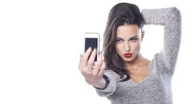 Love clicking selfies? Study says you are overestimating your beauty