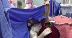 Watch this man play a guitar while doctors remove his brain tumour
