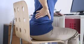 Can back or spinal pain be a symptom of breast cancer recurrence?