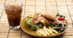 Why drinking cola with meals is a bad idea?