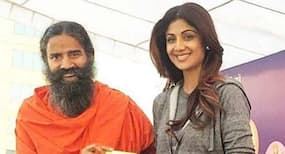 Shilpa Shetty performs yoga with Baba Ramdev at his yoga camp