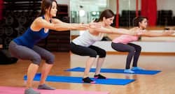 Do a set of squats for toned hips, abs, shoulders and killer legs