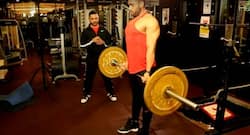 Build stronger back with bent over barbell row