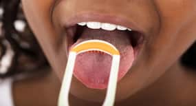 Use a copper tongue scraper to clean your tongue. Here's why!
