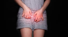 Why do women suffer from UTIs post pregnancy?