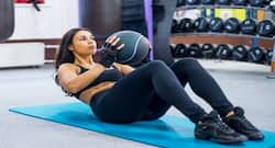 Here's how medicine ball exercises can help you get a flat tummy