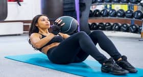 Here's how medicine ball exercises can help you get a flat tummy