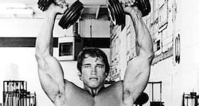 Get massive shoulders with the Arnold Dumbbell Press