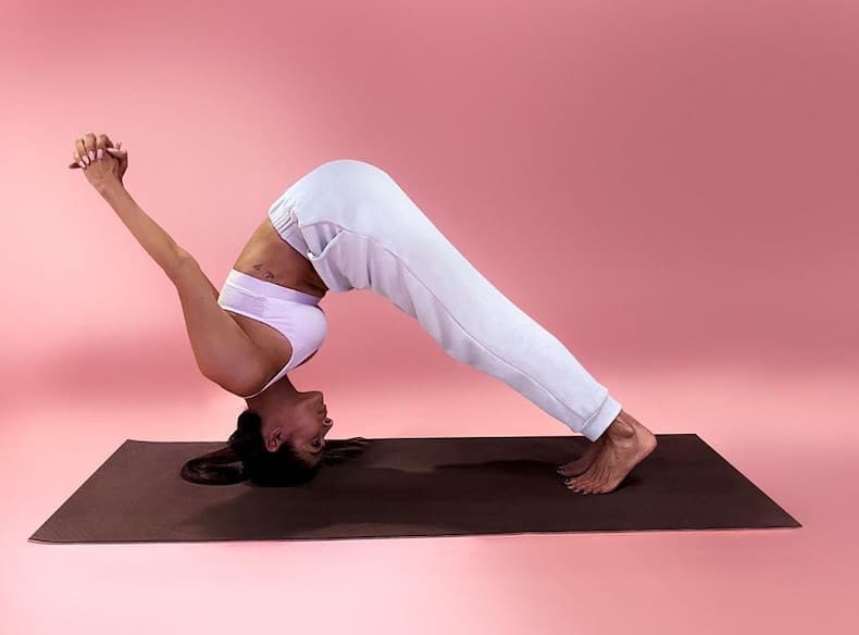 Strike these yoga poses like Malaika Arora and up your wellness quotient