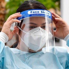 COVID-19: What happens when a face shield wearer is exposed to an infected person's sneeze